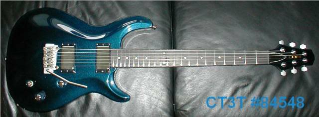 4/2006 : Solid Pearl Blue, Abalone dot inlays, M22T, Wilky : NOW w/Chrome p/up covers, and clear speed knobs.